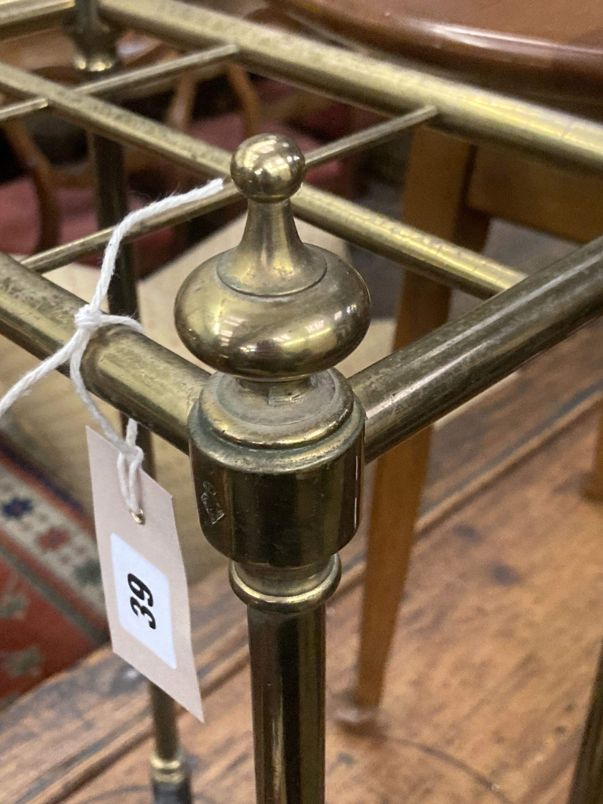A Victorian brass and cast iron six division stick stand, width 32cm depth 19cm height 62cm